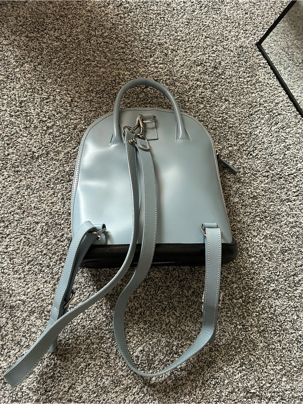 Dooney & Bourke “Pod Backpack” light blue